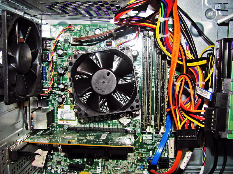 Technician disassembling computer components for recycling